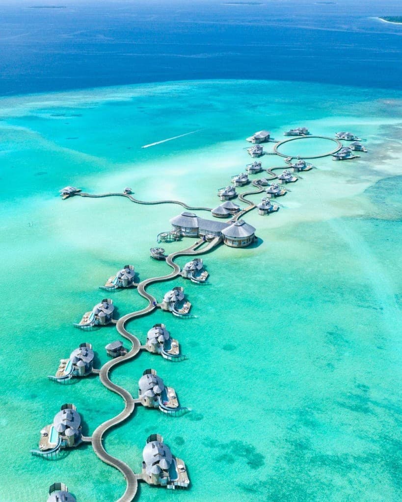 Aerial view of an overwater villa archipelago