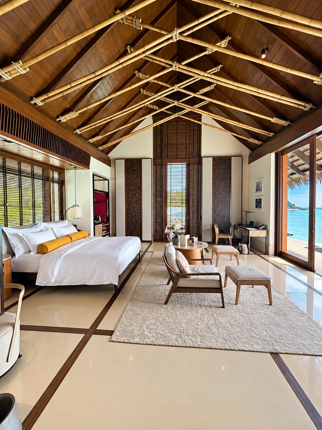 Dormitorio de villa con vistas a la laguna en One&Only Reethi Rah
